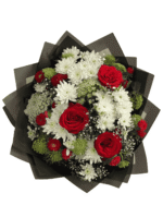 Bold and romantic — this striking bouquet combines deep red roses, red gerberas, white chrysanthemums, and lush greenery, wrapped in matte black paper with a crimson satin ribbon. A showstopping gift for birthdays, anniversaries, or date nights.
